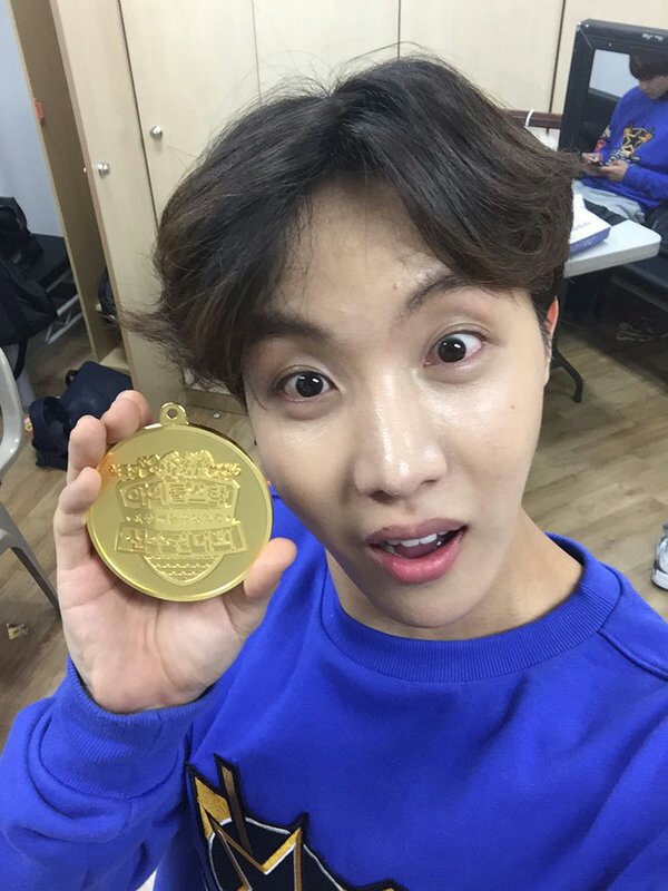 j-hope ugly pann postman-medal-closeup-indoors.
